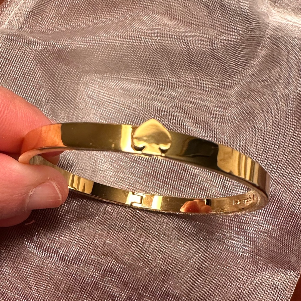 kate spade Gold Tone Spade Logo Bangle Bracelet